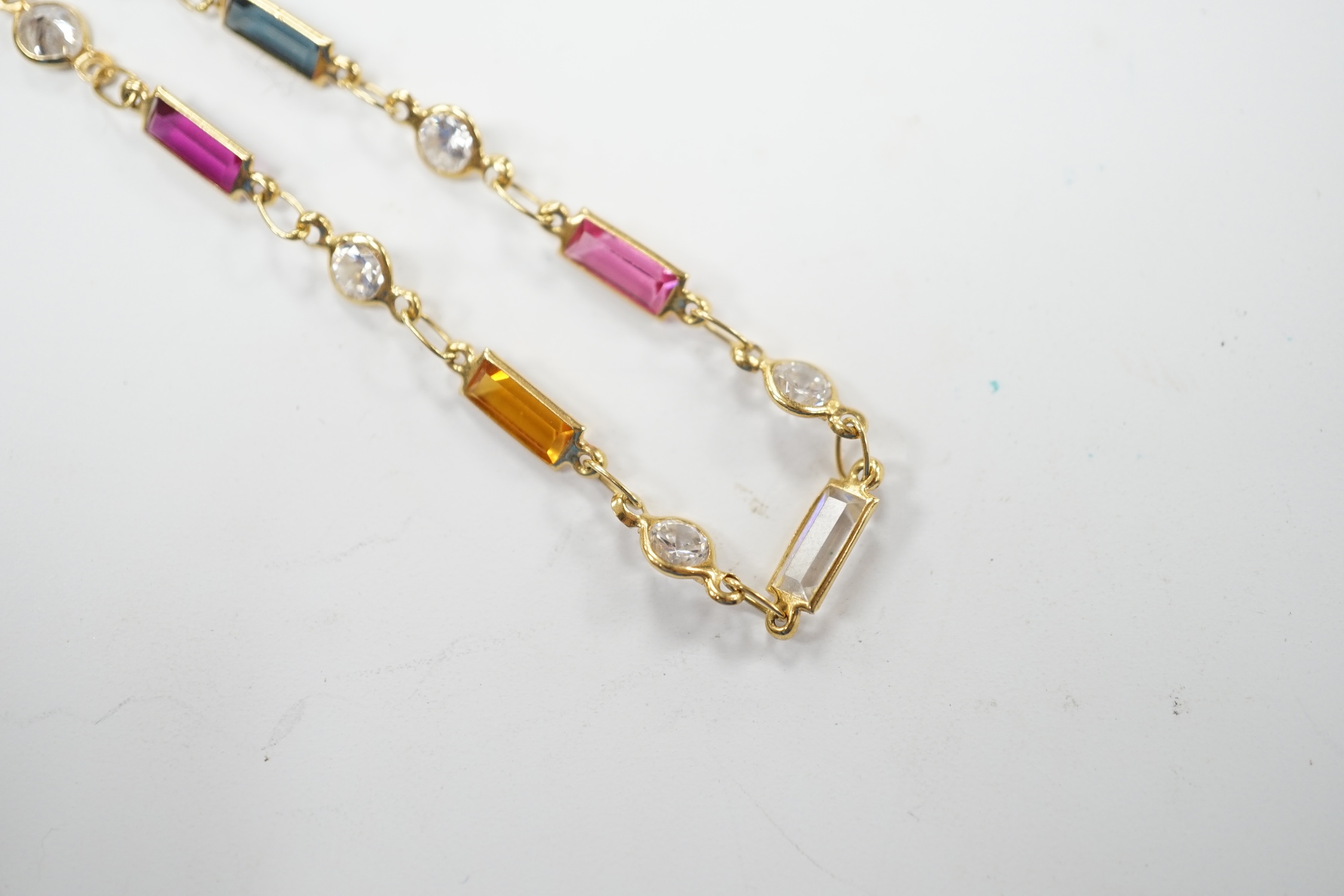 A modern 750 yellow metal and multi-gem set bracelet, 18.5cm, gross weight 2.7 grams. Fair condition